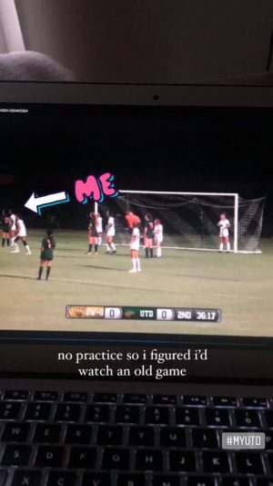 Laptop displaying a video of a Comets womens soccer game. An arrow and the word, me, points to Sofia on the left side of the screen.