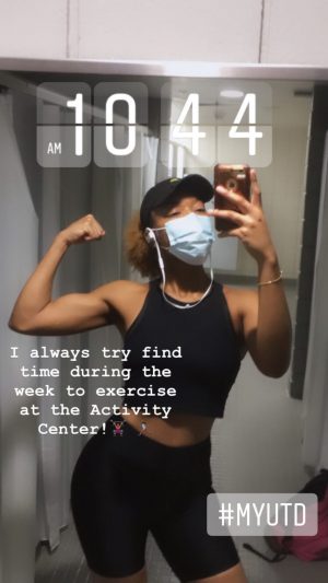 I always try to find time during the week to exercise at the Activity Center. Pictured, olamide poses for a selfie at the gym; she flexes an arm. 