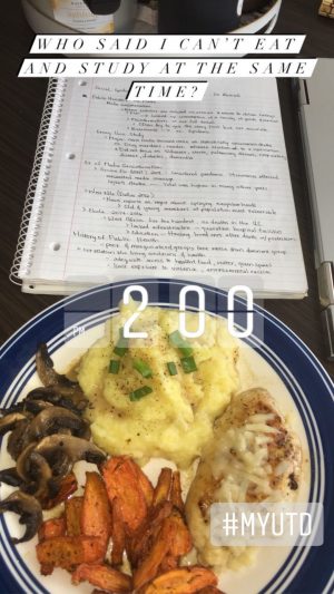 Who said I can't eat and study at the same time? Pictured, a spiral notebook and plate of lunch on a table top.