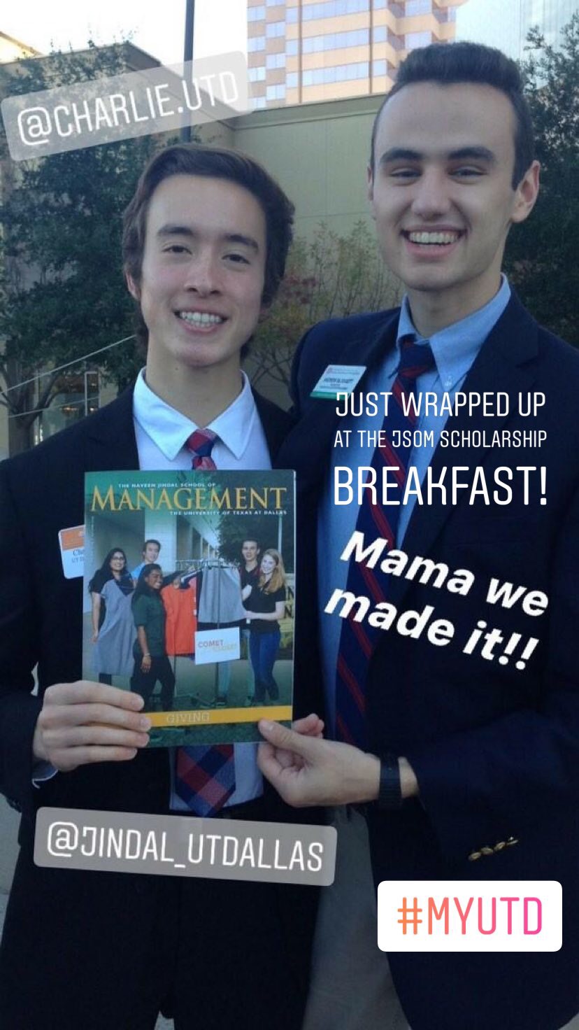 Charlie and another person, both wearing suits and ties, hold up a copy of Management magazine.