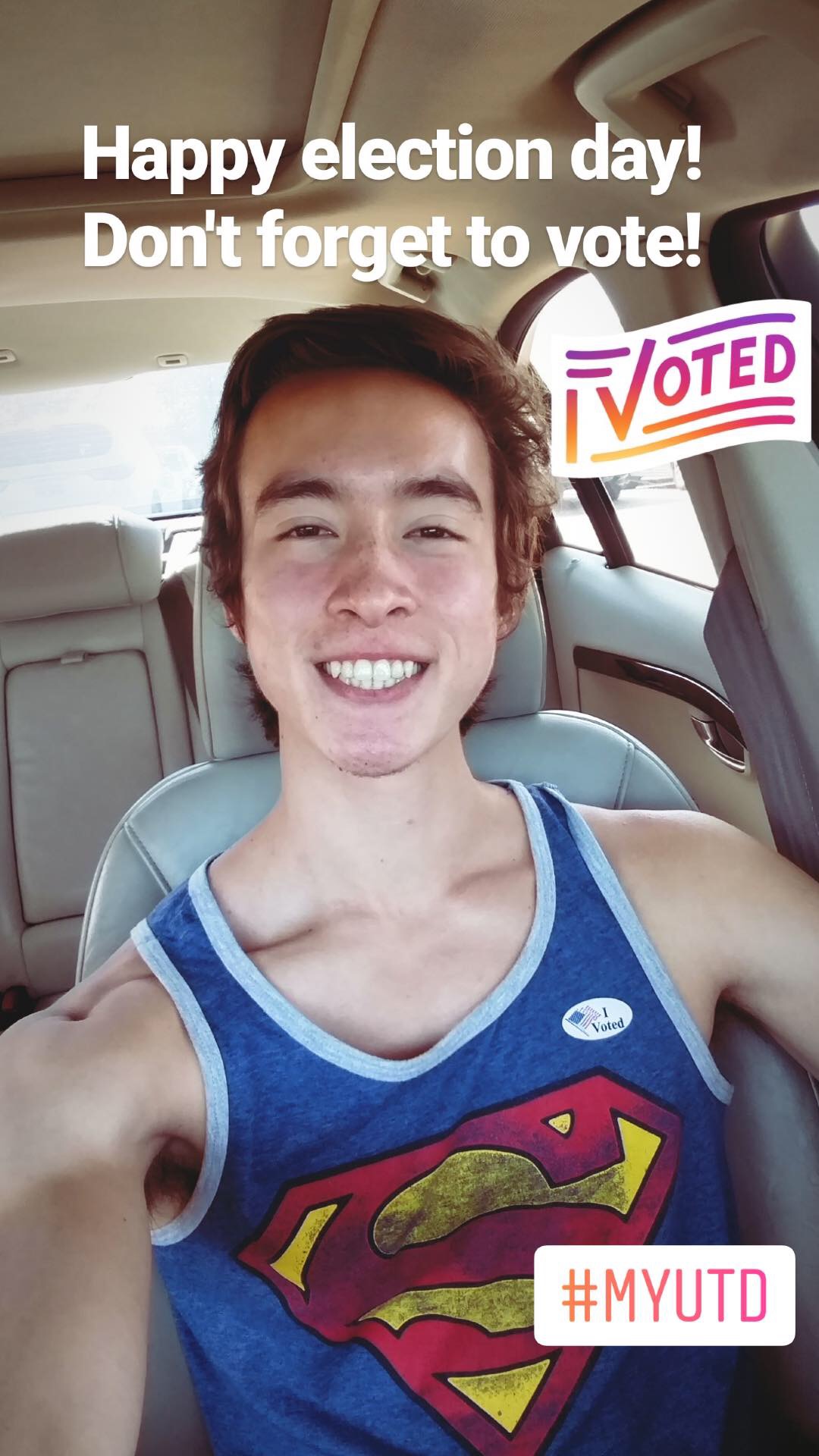 Selfie of Charlie in the car wearing an I Voted sticker.