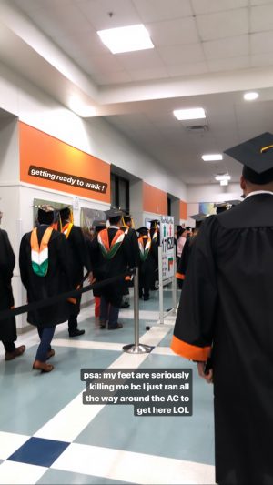 Two lines of graduating students in caps and gowns. 